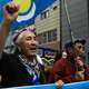 Rebiya Kadeer, president of the World Uyghur Congress (WUC) and people chant slogans and wave flags during a protest march on June 29, 2019 in Osaka, Japan.
